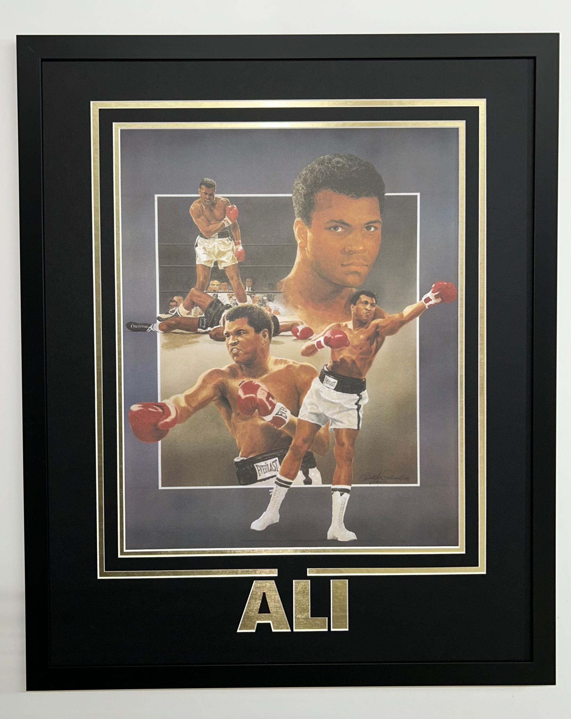 Framed Muhammad Ali boxing collage with gold trim and “ALI” text