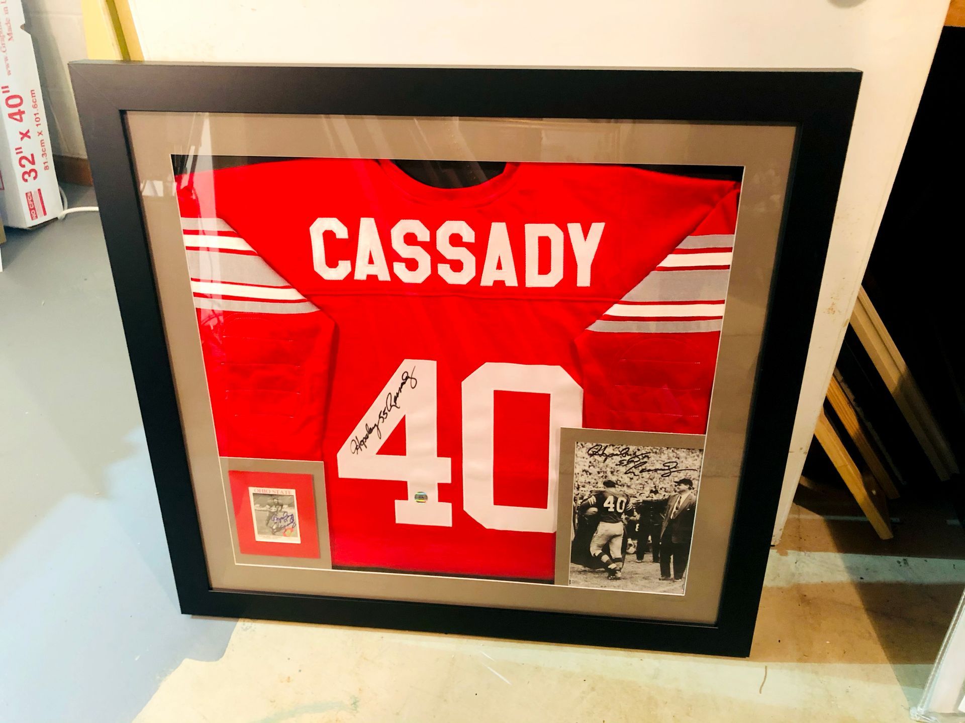 Framed red Cassady #40 hockey jersey with white stripes and a small black-and-white photo
