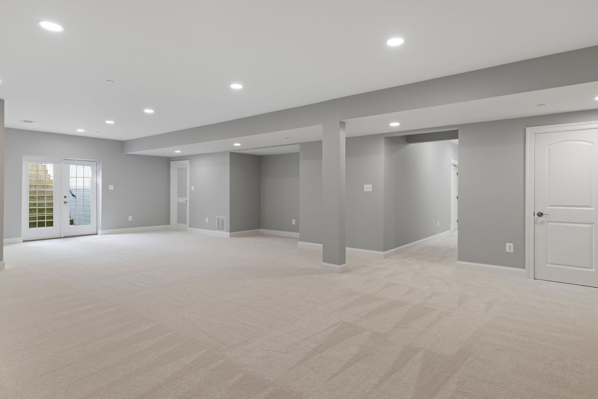 Professional basement finishing service converting an unfinished area into a functional living space.