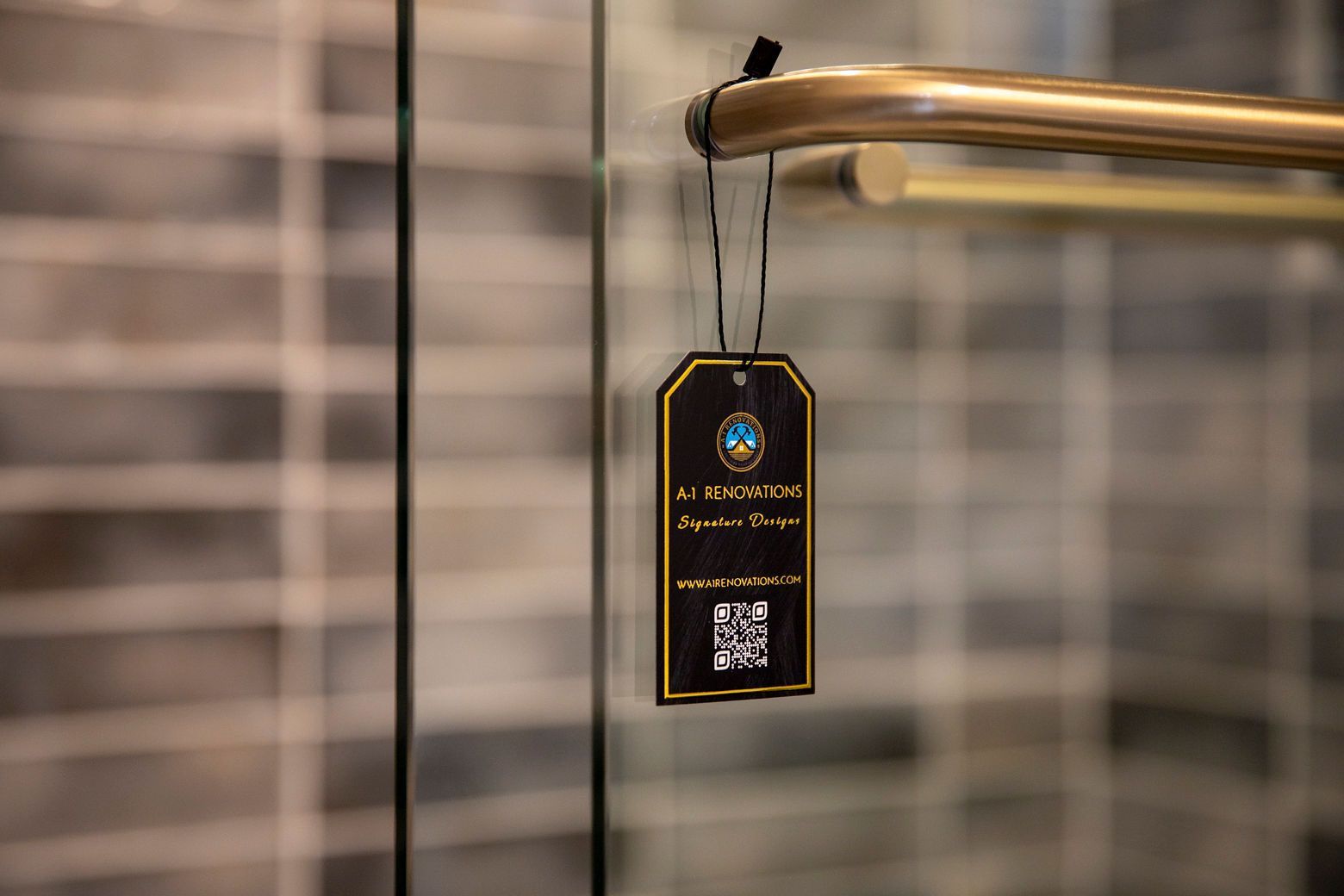 Newly remodeled bathroom featuring a mix of gold and black hardware.