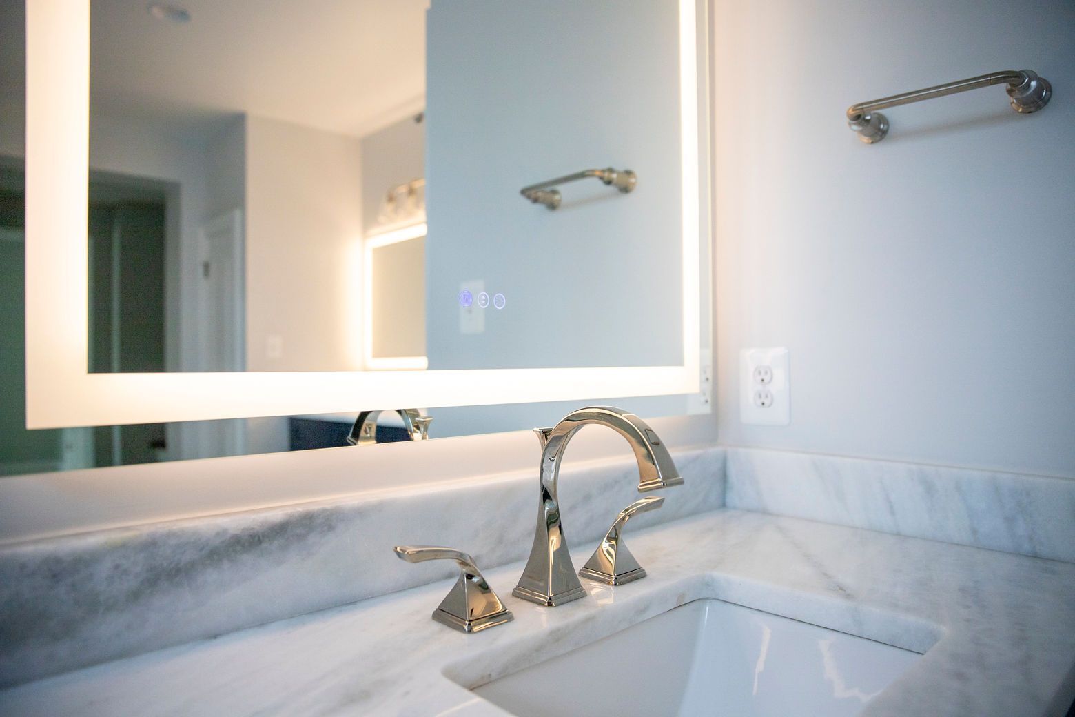 Completed bathroom remodel showing a sophisticated, streamlined design.