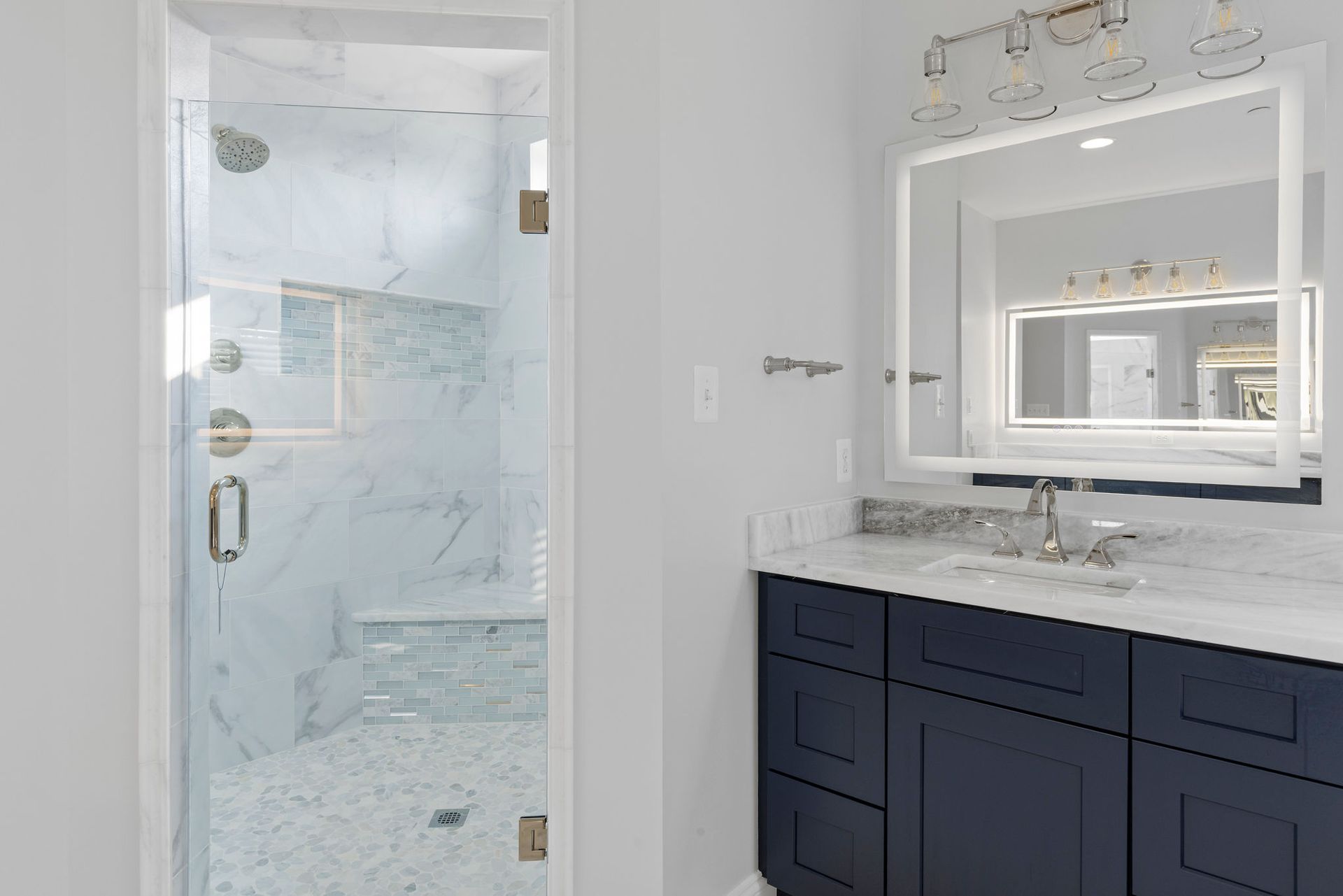 Before and after of a Reisterstown bathroom. Old corner tub replaced with a sleek freestanding tub.