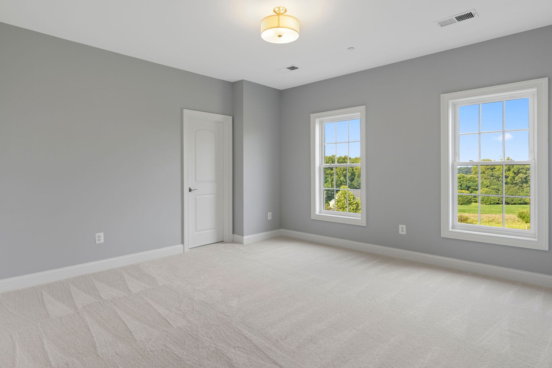 A bright and beautifully finished bedroom after a full-scale remodel, ready for furniture.