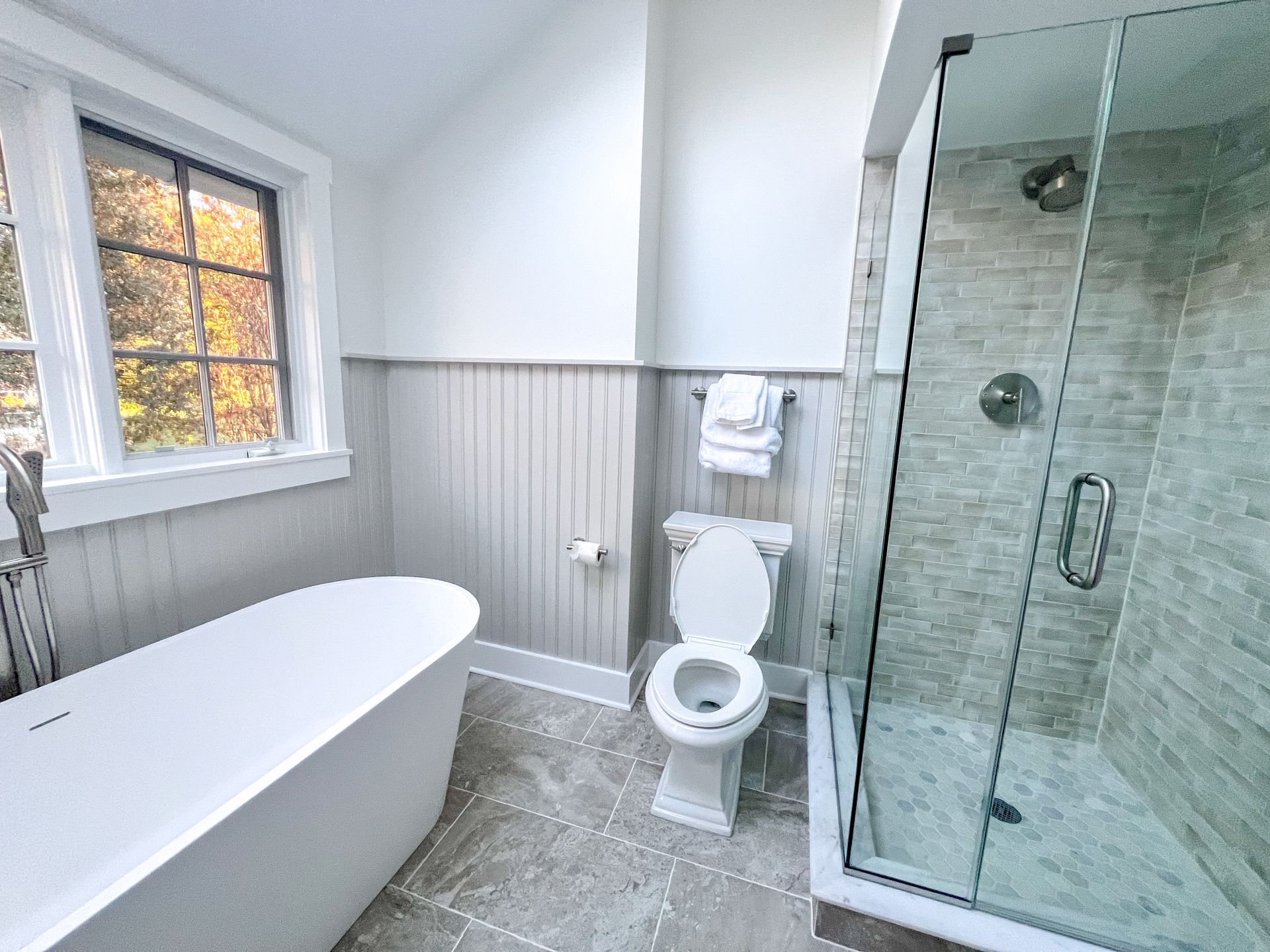 Modern shower with gray and white tile in an Owings Mills bathroom.