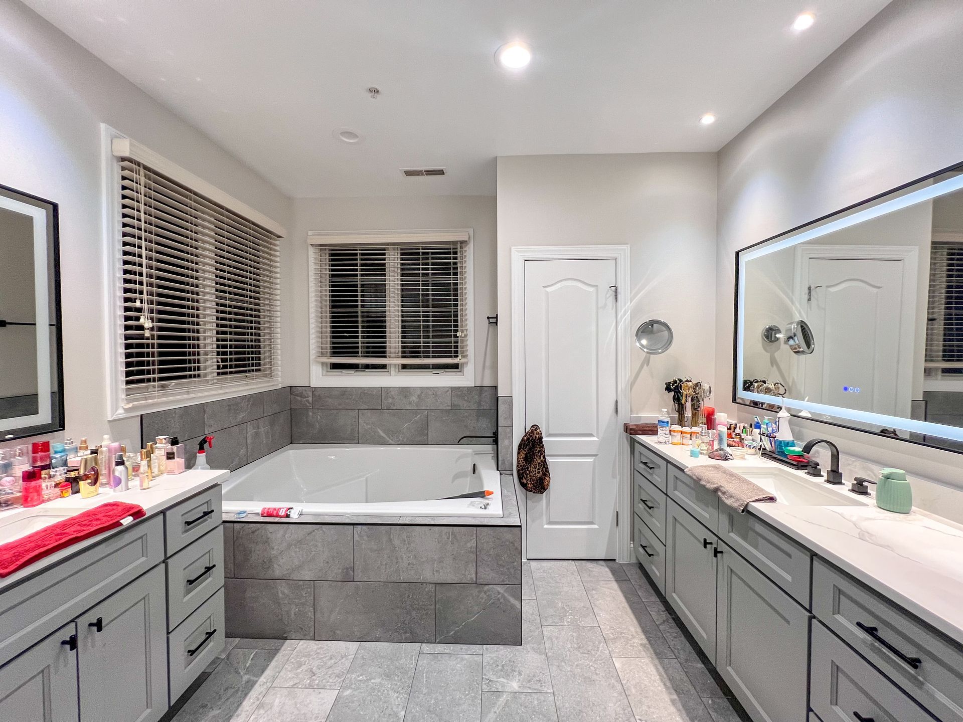 Double vanity with shaker-style cabinets and quartz countertop in a renovated bathroom in Westminster, MD.