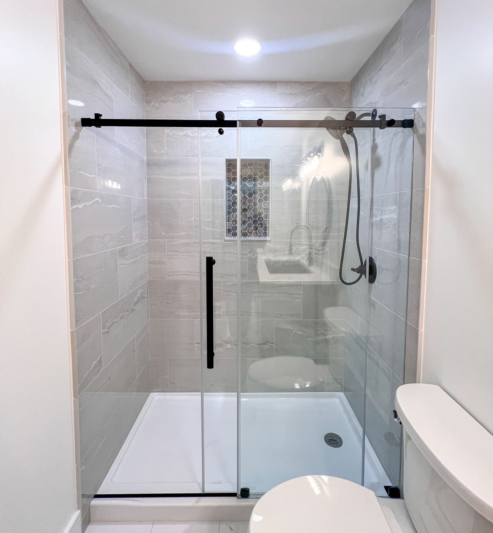 Owings Mills bathroom renovation showcasing a walk-in shower and shower door.