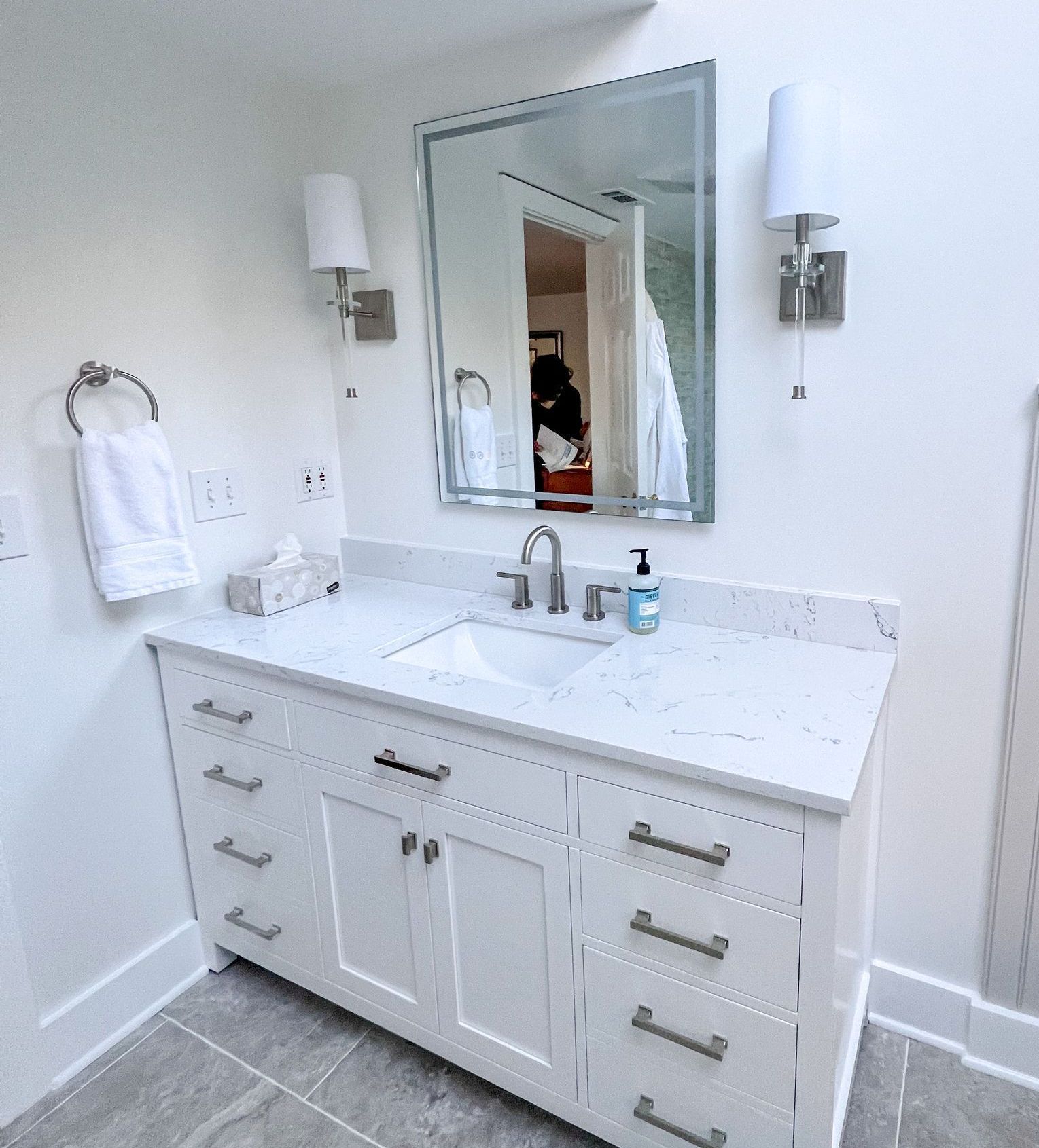 Light gray vanity with modern faucet in an Owings Mills bathroom.