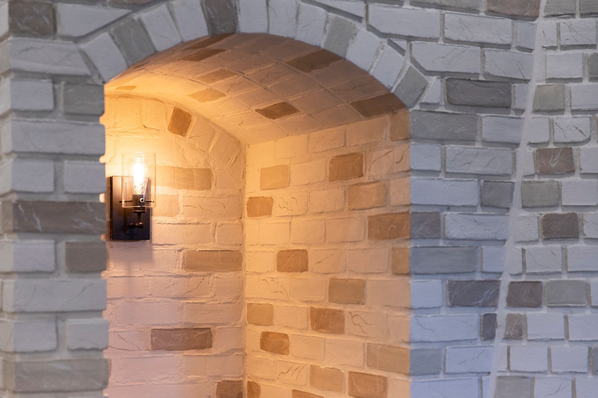 A view of the custom-built shelving unit next to the fireplace, demonstrating smart use of space.