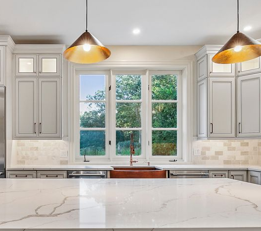 Before and after of a full kitchen gut and remodel. We installed all new cabinets, countertops, and appliances for a total transformation