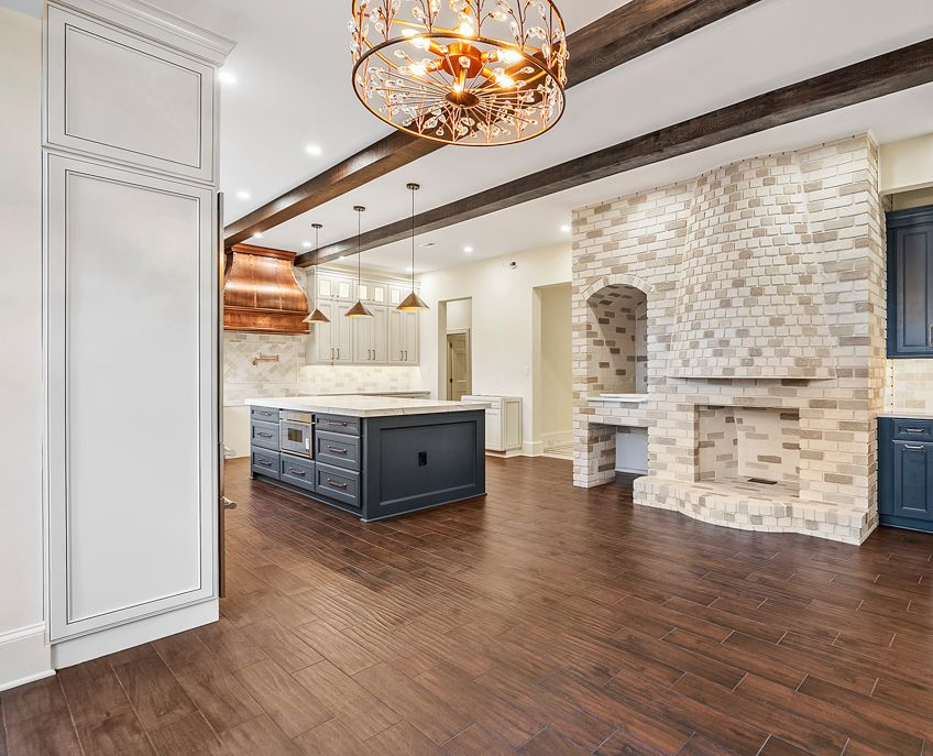 Before & After: Unfinished kitchen transformed into a modern, open-concept space.