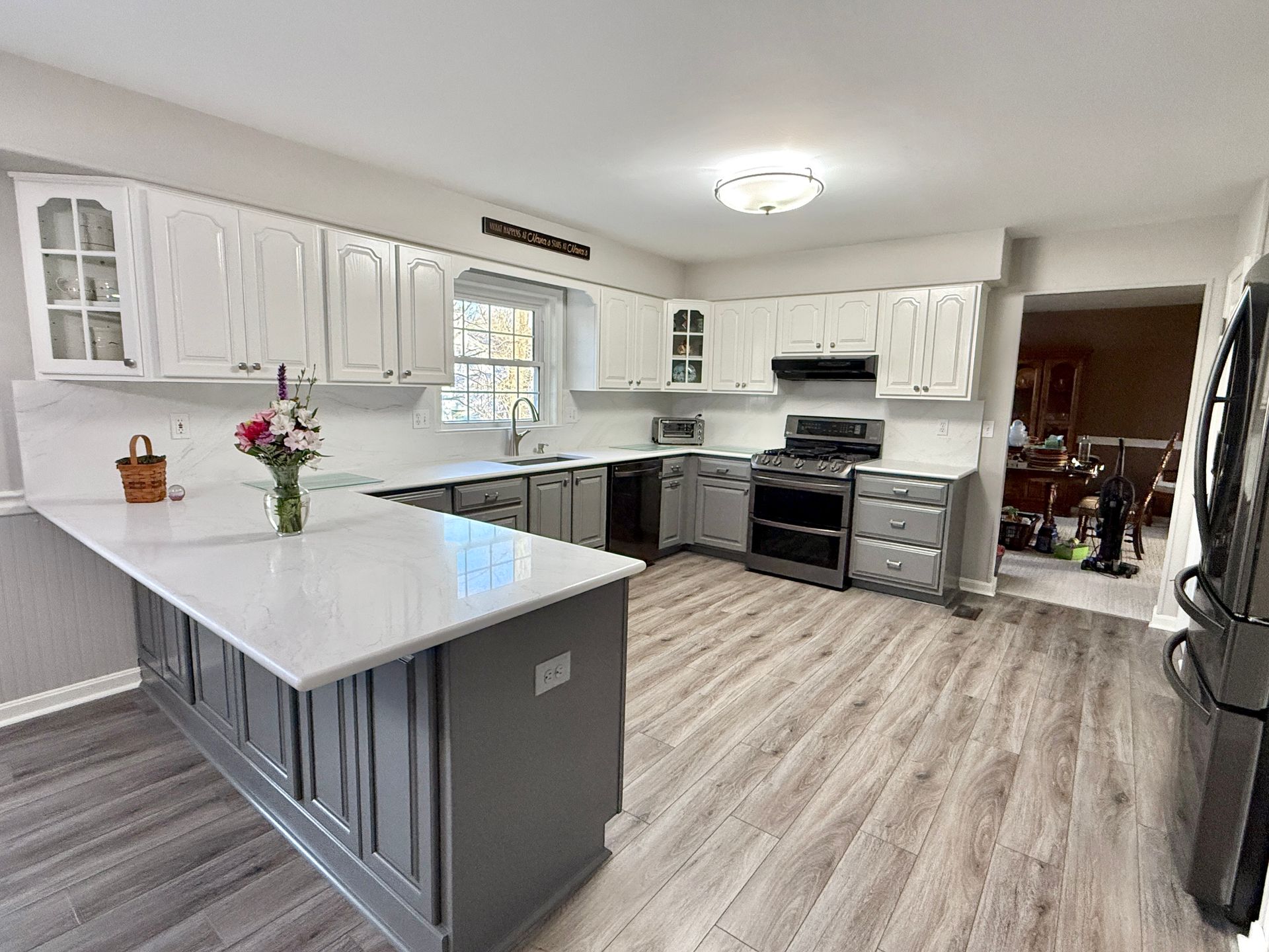 Modern Ellicott City kitchen with smooth two-tone cabinets.