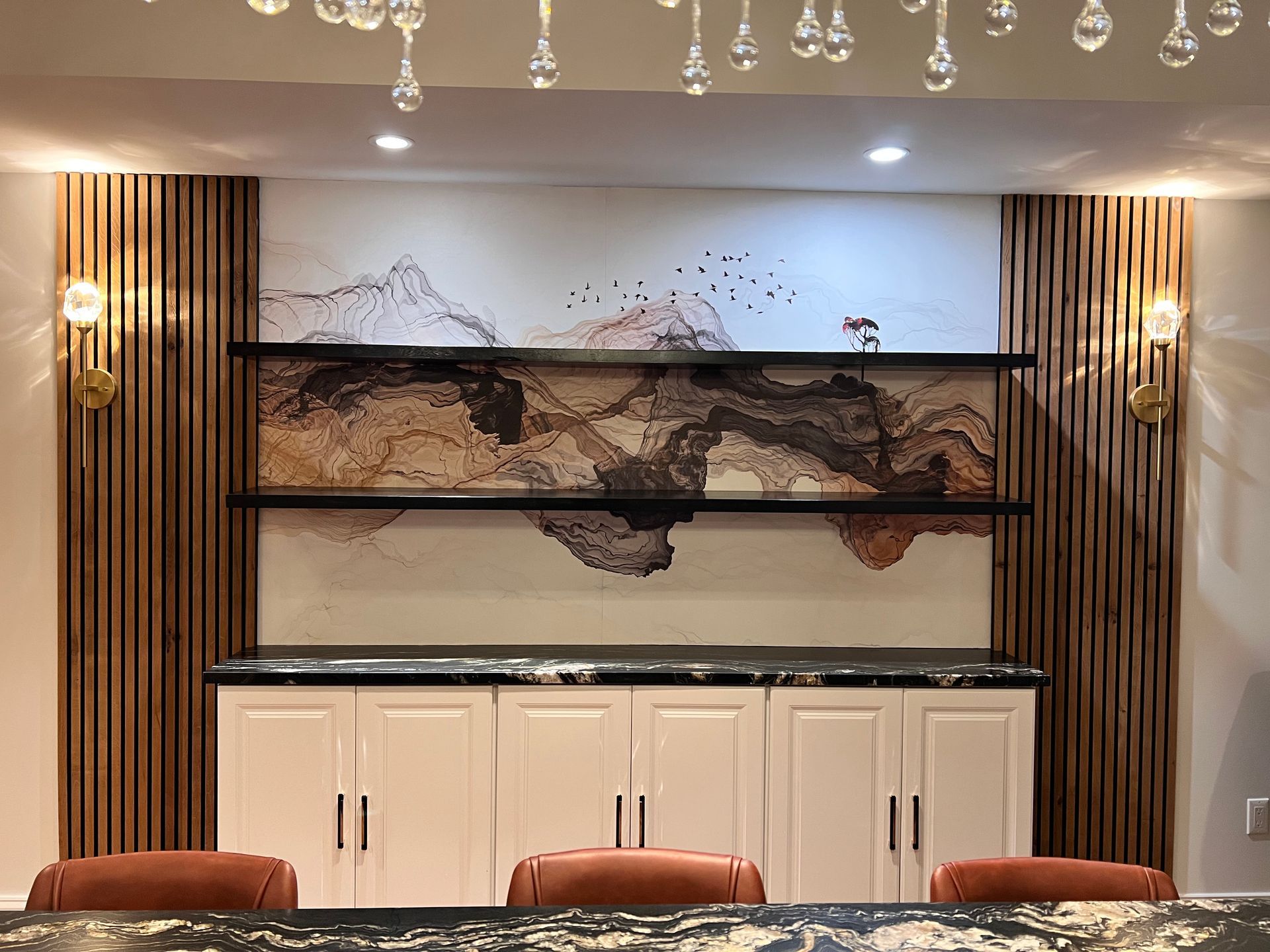 Artistic feature wall in a finished Bel Air basement, combining natural wood, abstract art, and storage solutions.