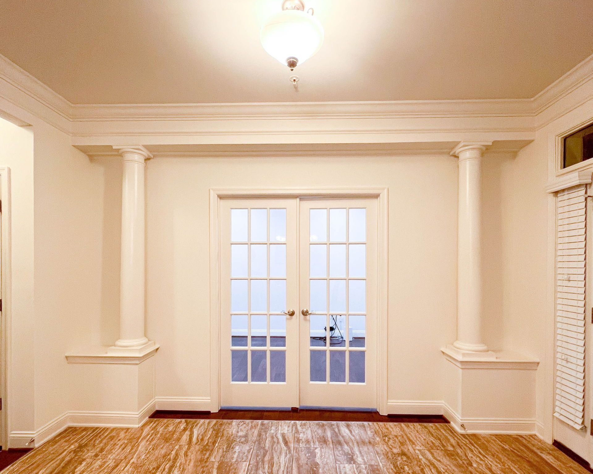  Temporary wall with French doors, creating home office.