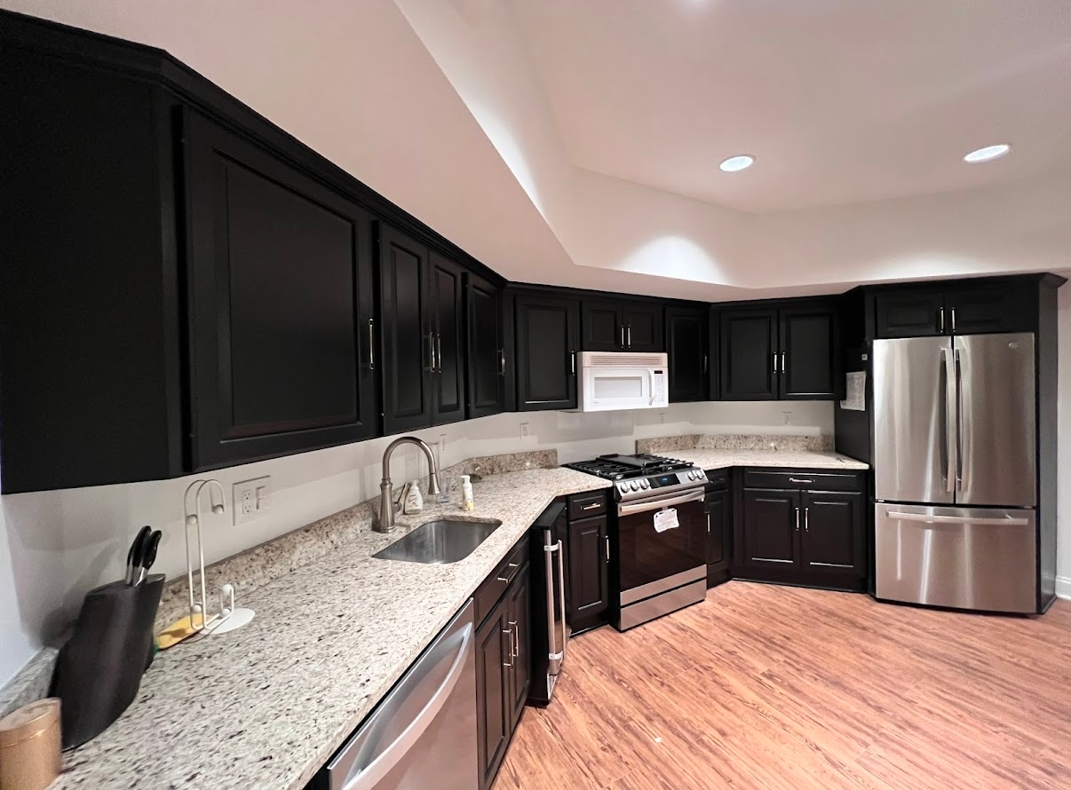 A Dark Colored Kitchen Cabinets with stainless steel Appliances in Eldersburg, MD