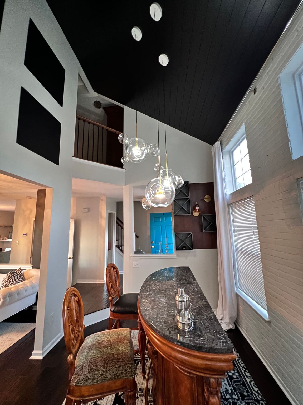 Bright and inviting foyer with beautiful flooring and tasteful architectural details in Baltimore County