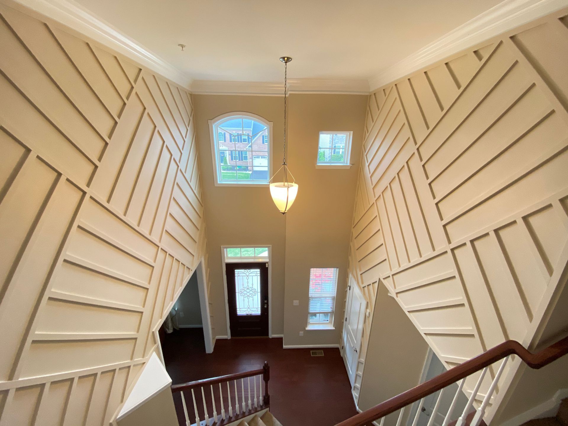 Wainscoting installation in a foyer in Greater Baltimore, MD, extending to the ceiling.