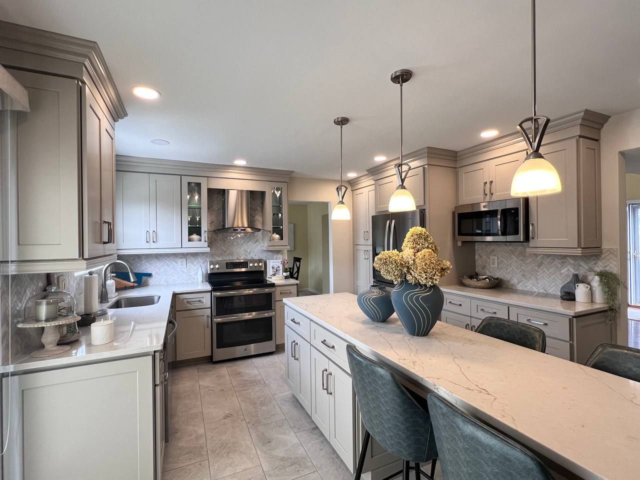 Sykesville kitchen remodel: Light gray cabinets, island, stainless steel.