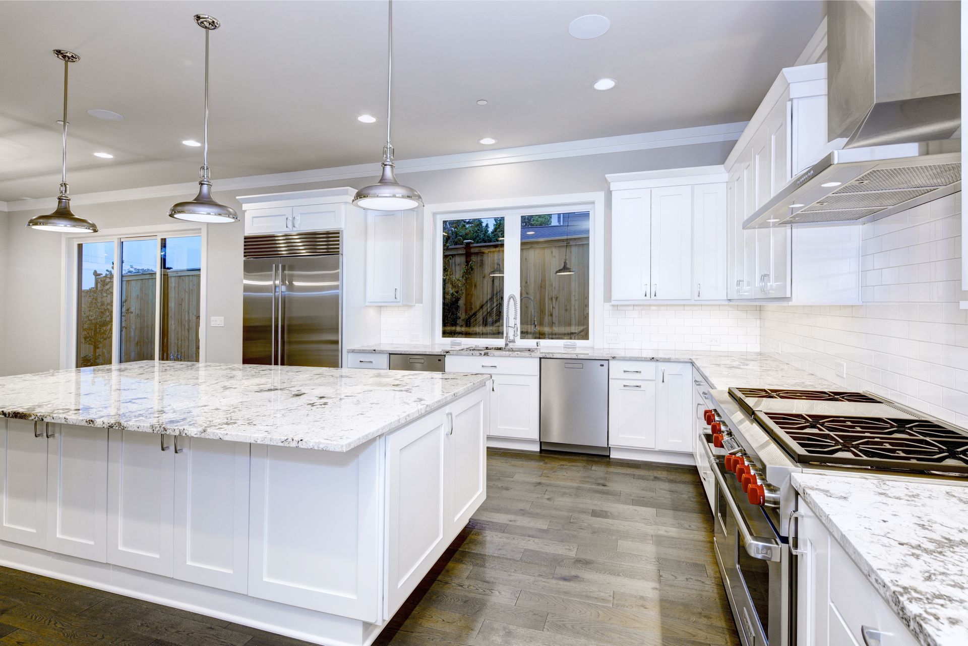 Clean lines, bright white cabinets, and a spacious island define this stunning kitchen remodel in Timonium.