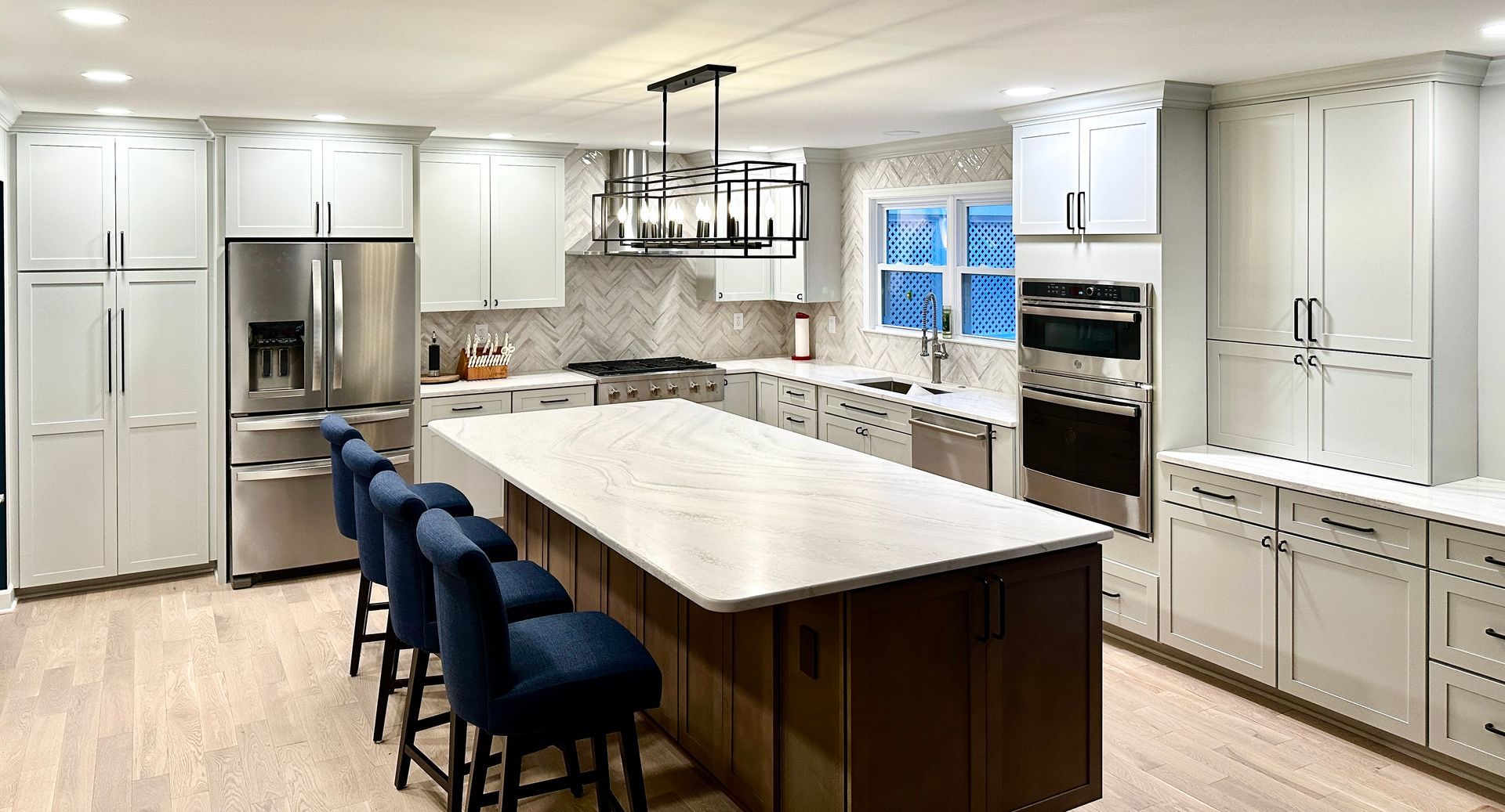 Modern kitchen with gray cabinets and a contrasting island in Catonsville, Maryland.