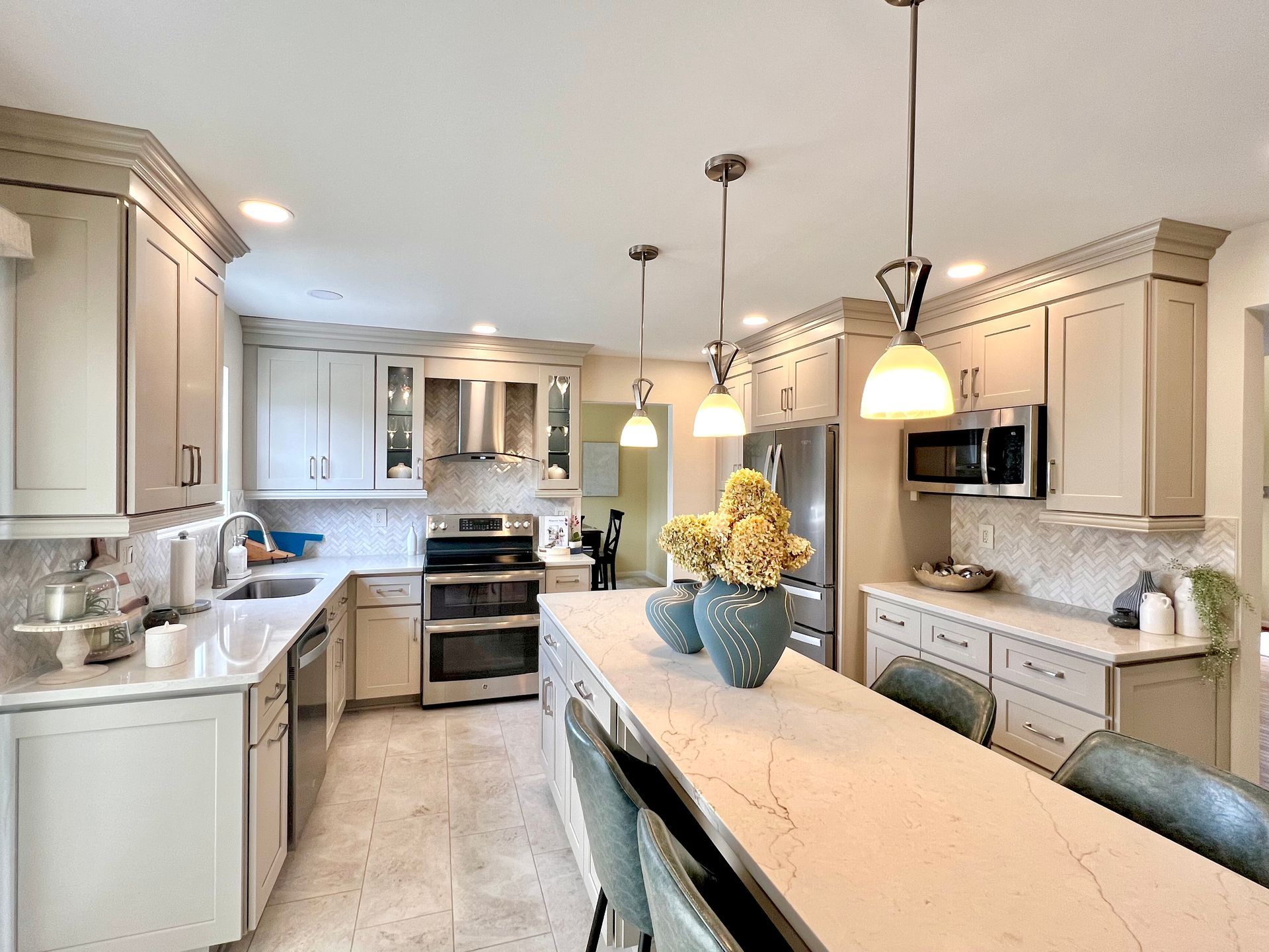 Contemporary kitchen renovation with custom cabinetry and high-end appliances in Columbia, MD