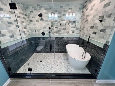 Elegant master bathroom design featuring a freestanding tub inside a spacious walk-in shower In Jessup, MD.