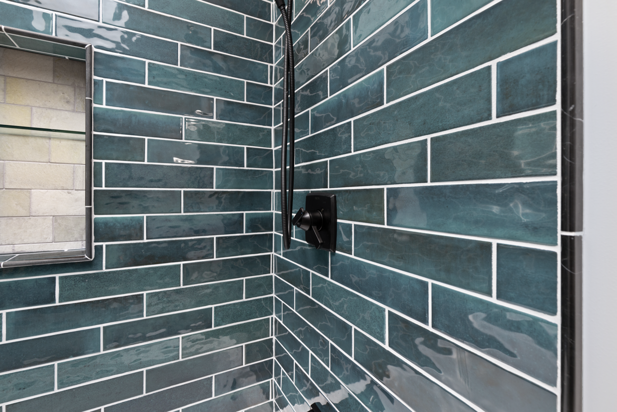 A clean, elegant master bath with a freestanding tub as the centerpiece.