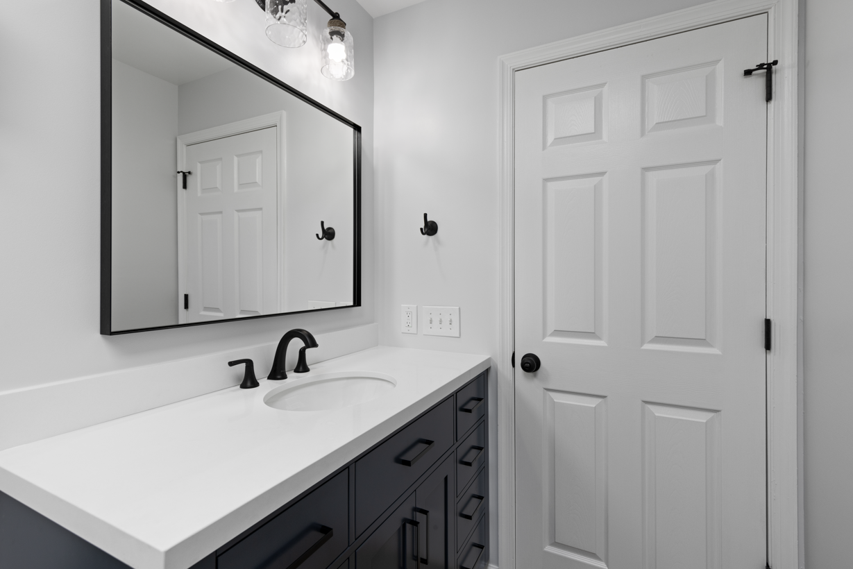 Completed bathroom project in Ellicott City with a sleek tub/shower combo and modern design.