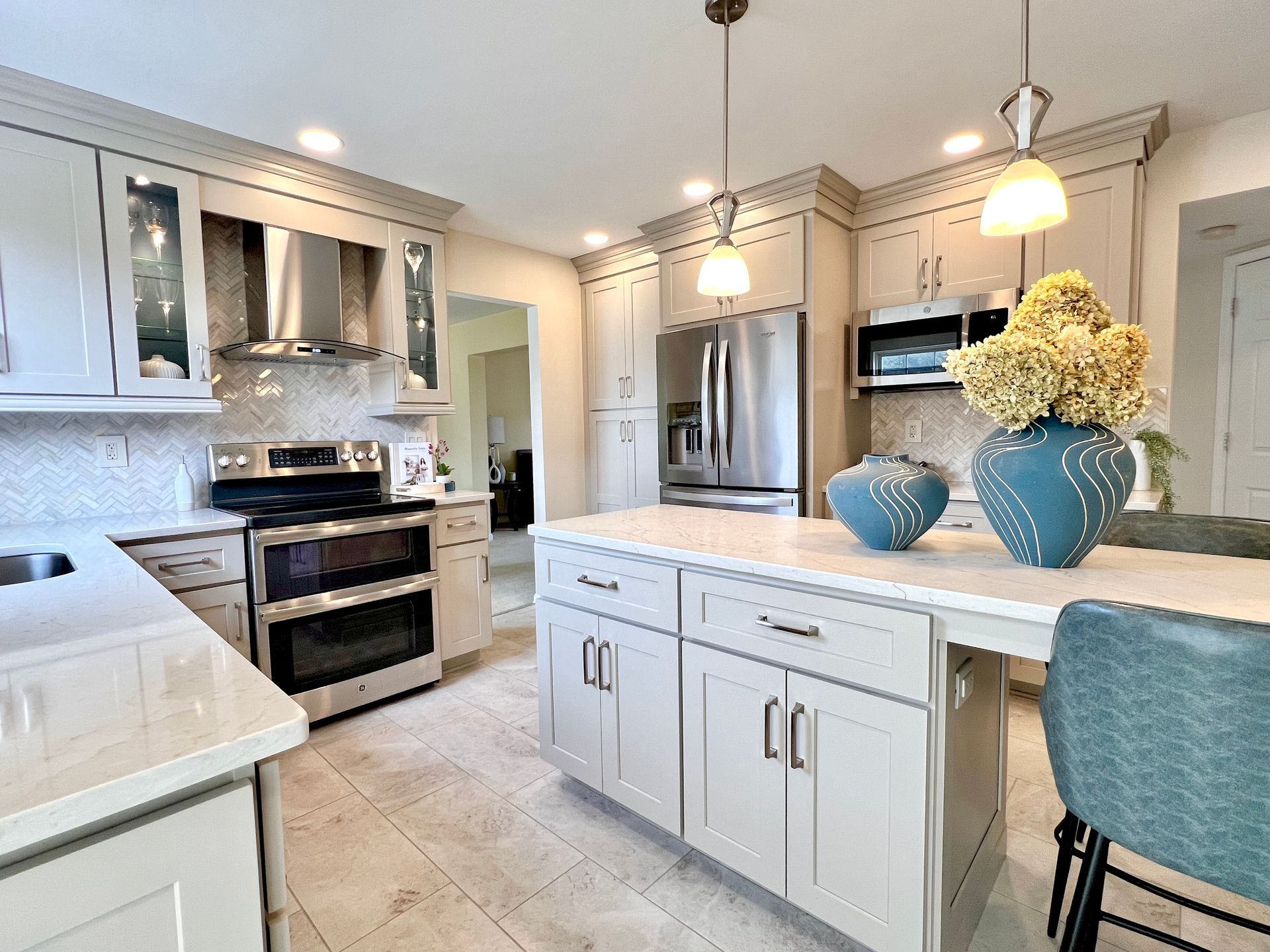 Modern kitchen transformation including expert backsplash tiling and high-end fixture updates.