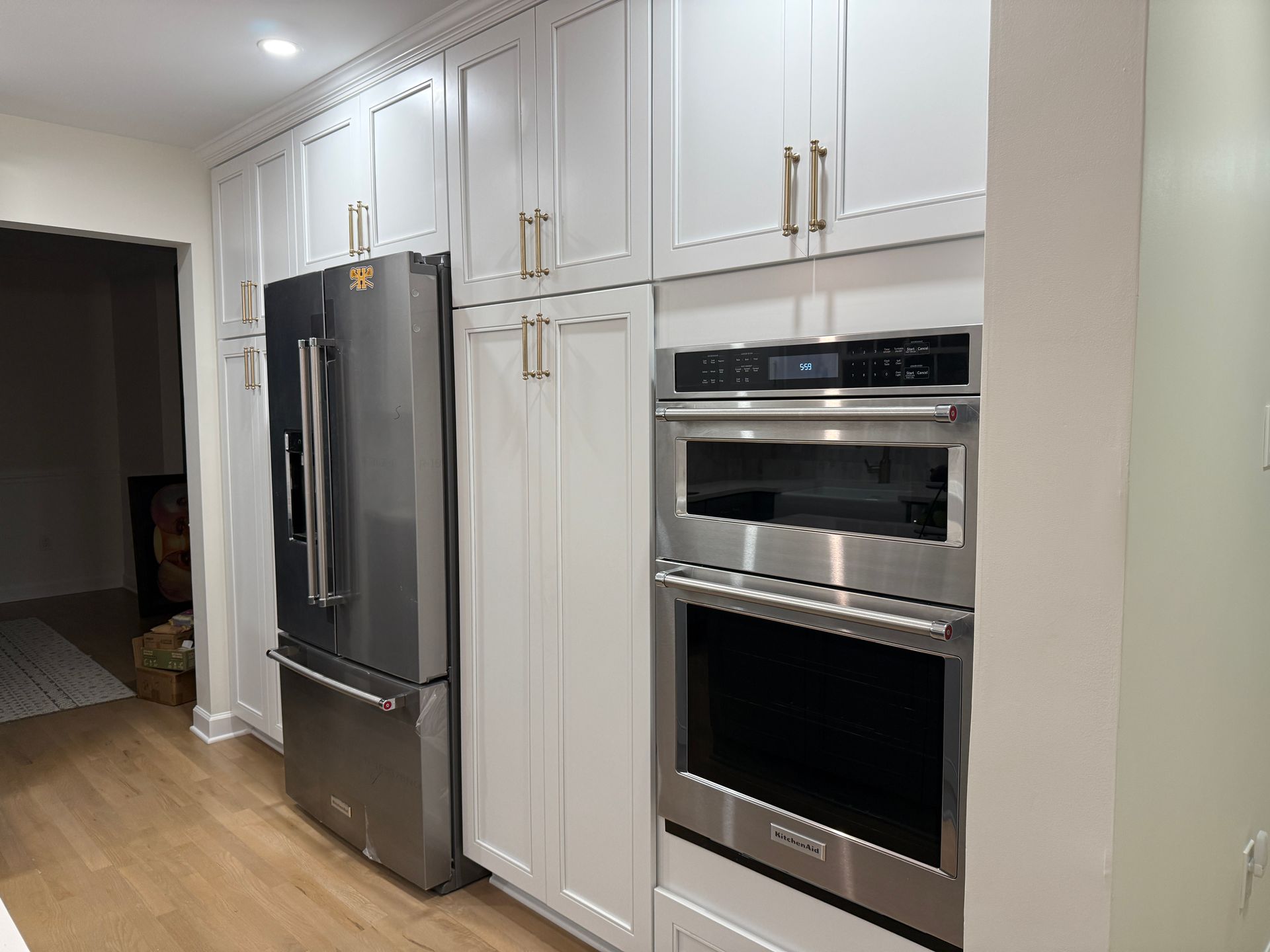 Custom built-in appliance wall and cabinetry installed with expert precision in Monkton kitchen.