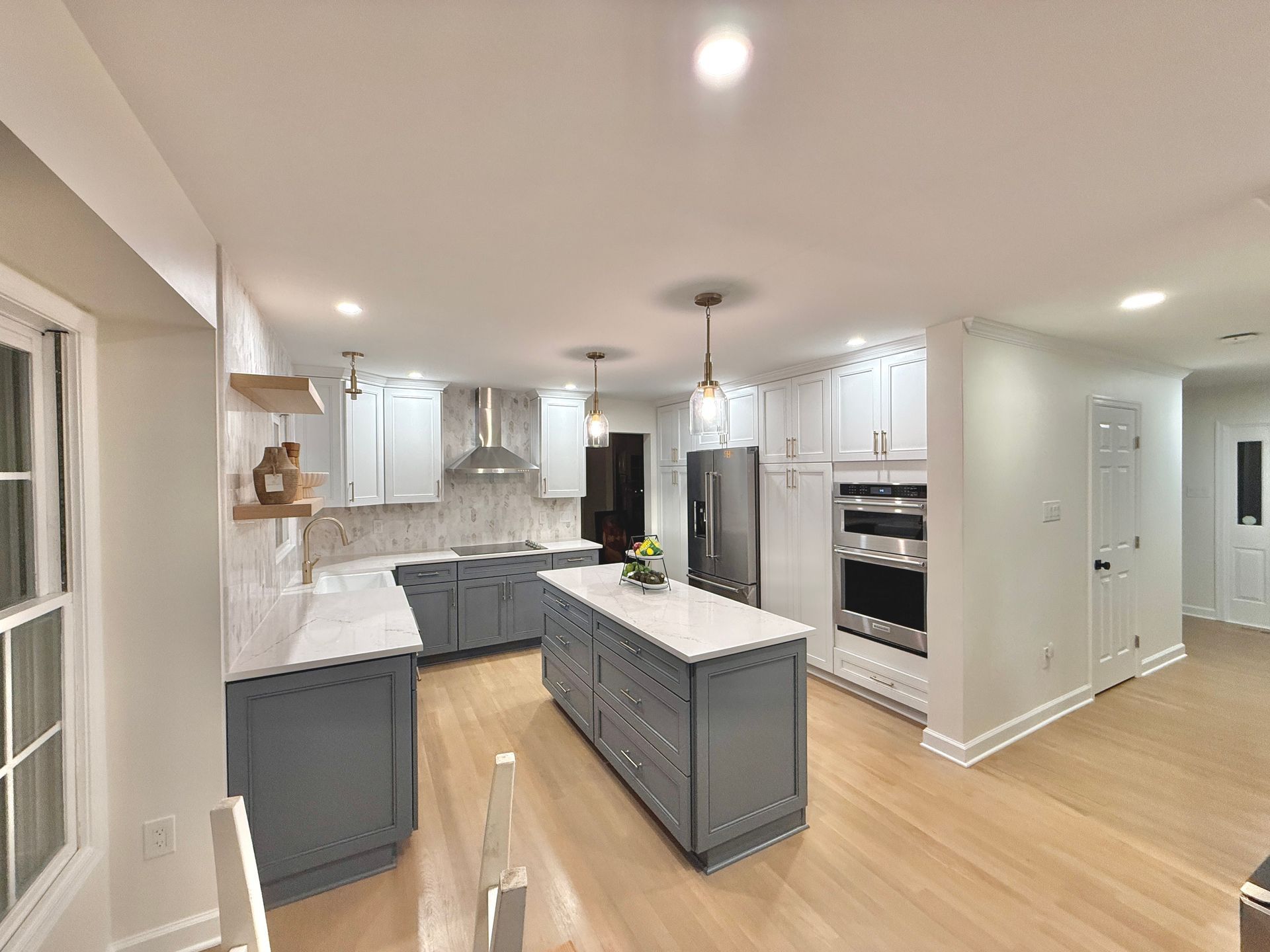 Flawless installation of the kitchen faucet and apron-front (farmhouse) sink.