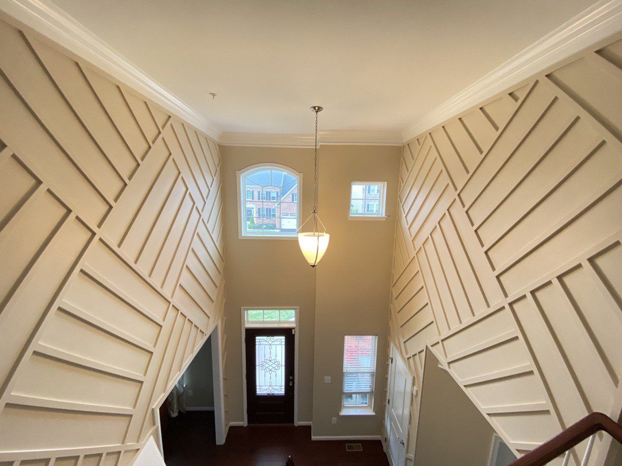 Elegant custom molding work in the foyer enhancing the entryway with sophisticated design in Westminster, MD.