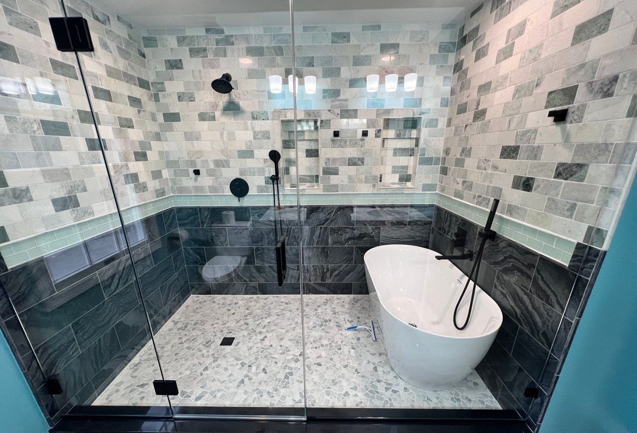 Elegant master bathroom design featuring a freestanding tub inside a spacious walk-in shower In Westminster, MD.