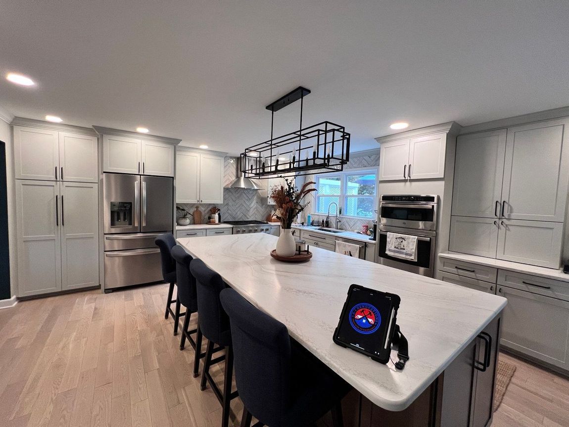 Modern kitchen remodel with sleek cabinetry, stainless steel appliances, and a spacious island in Baltimore County