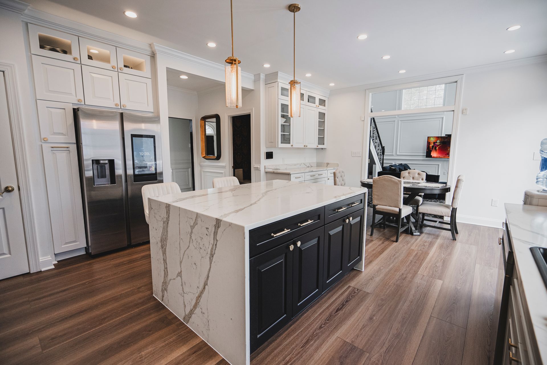 Clean and modern kitchen design featuring updated cabinetry and lighting.