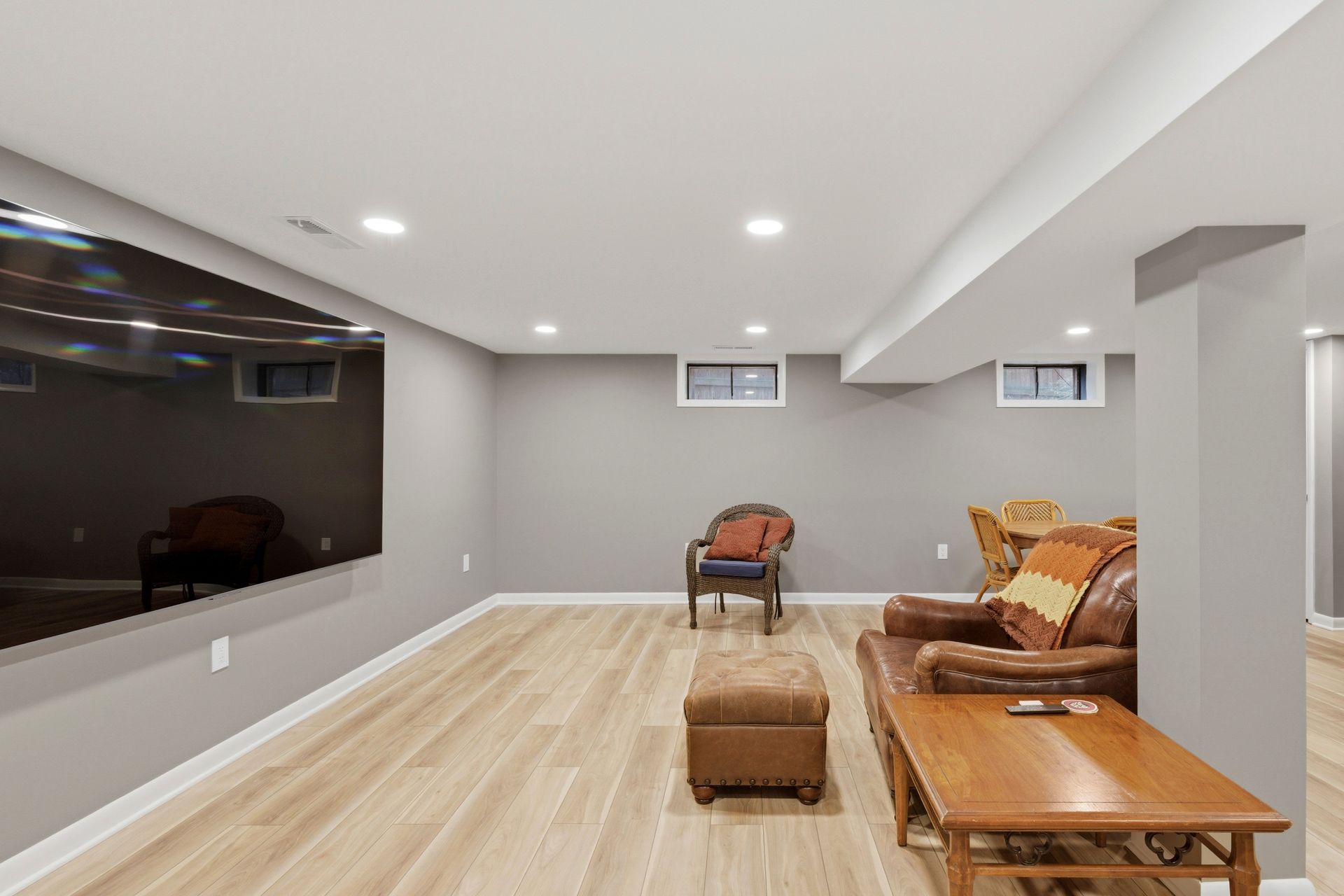 See how we transformed a dark, unfinished basement into a luxury living space. From removing old pan