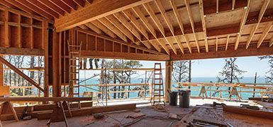 A house is being built with a view of the ocean.