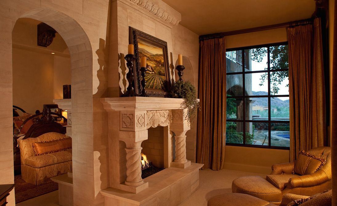 A living room with a fireplace and a large window