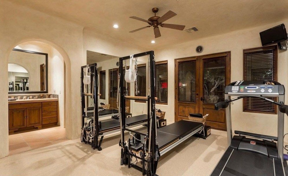 There is a treadmill in the middle of the room.