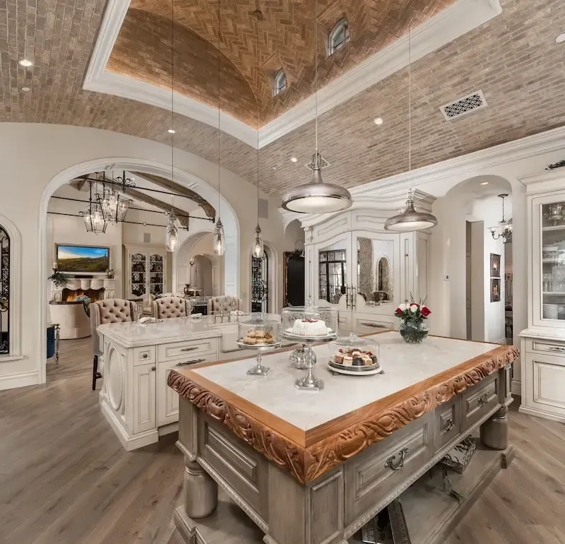 kitchen with double island and barrel vault ceiling