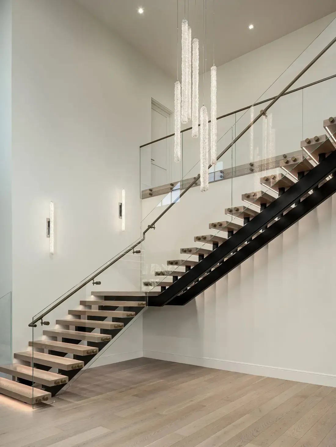 modern lighting by floating staircase