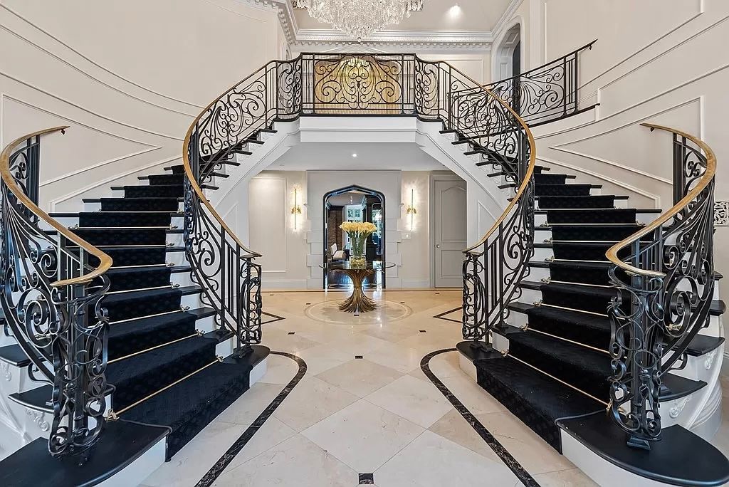 There is a large staircase in the middle of the room.