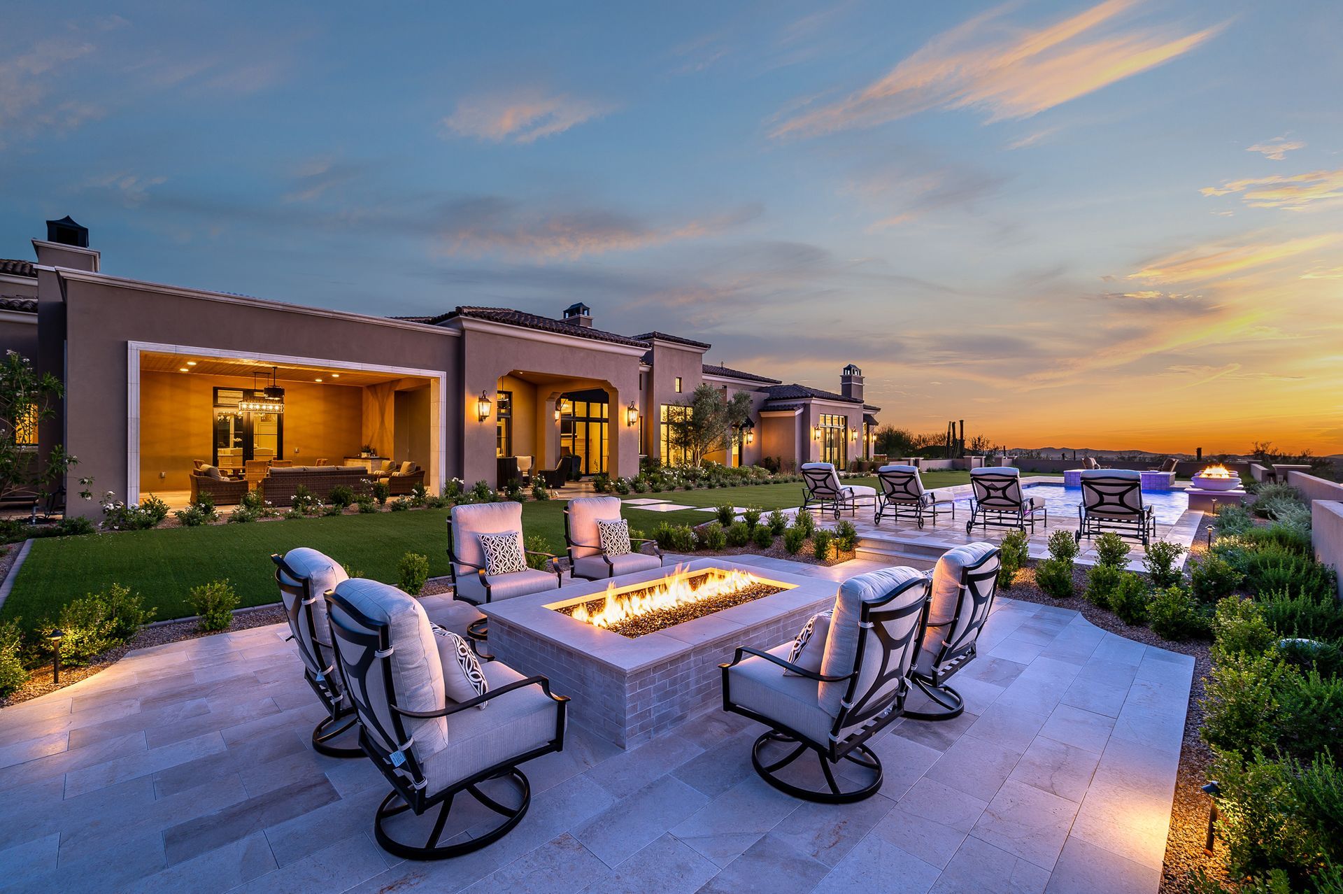 luxury backyard with firepit, pool, and high-end furniture