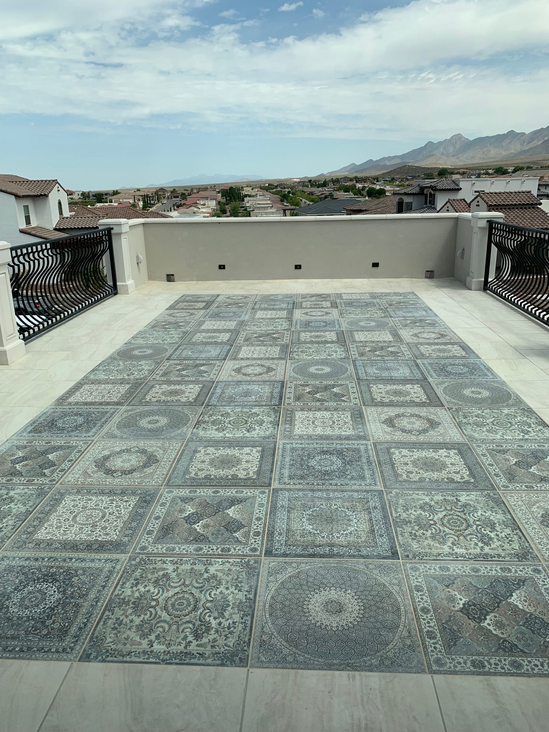 There is a large rug on the roof of a building.