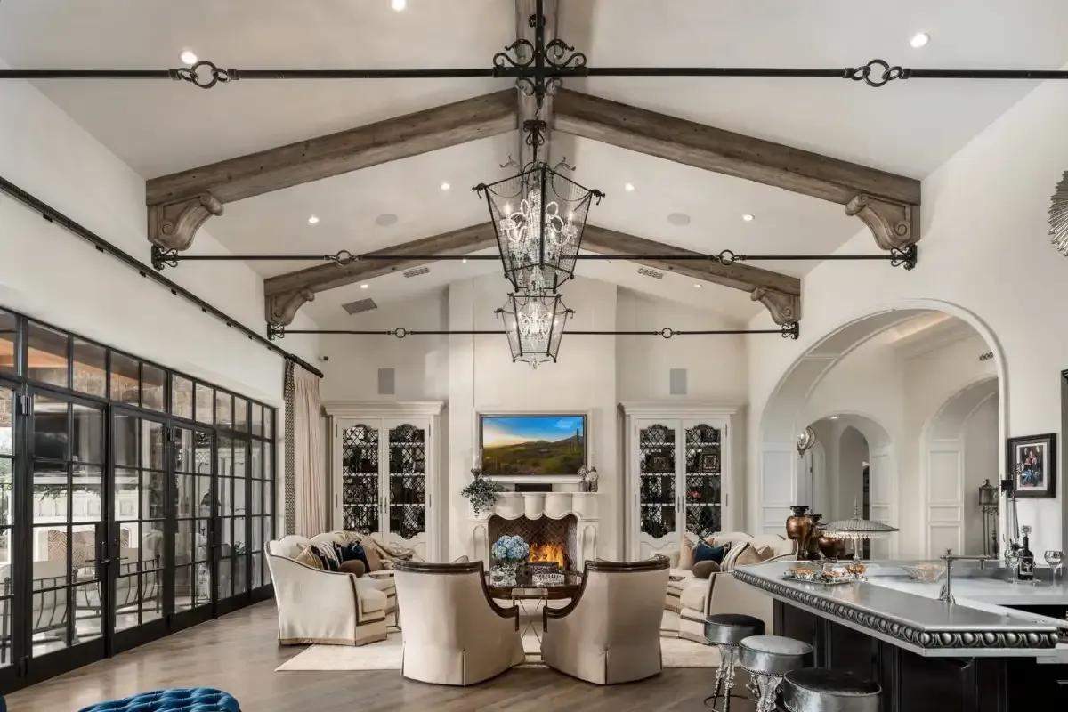 Dining room with a long table and chairs, a wine rack, and a sideboard.