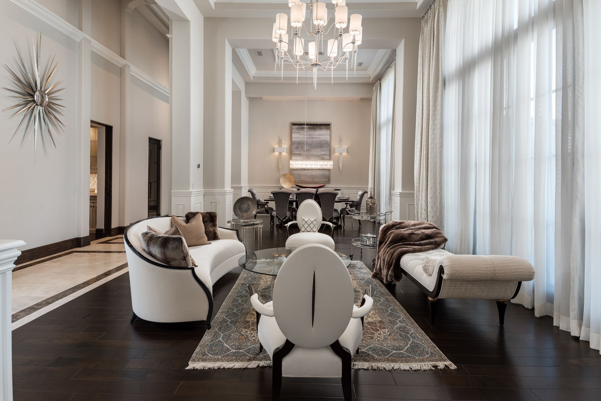 Custom luxury living room design with transitional style couch and seating, open concept layout.