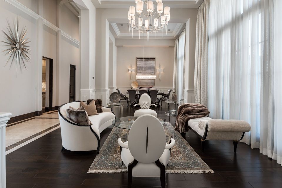 Custom luxury living room design with transitional style couch and seating, open concept layout.