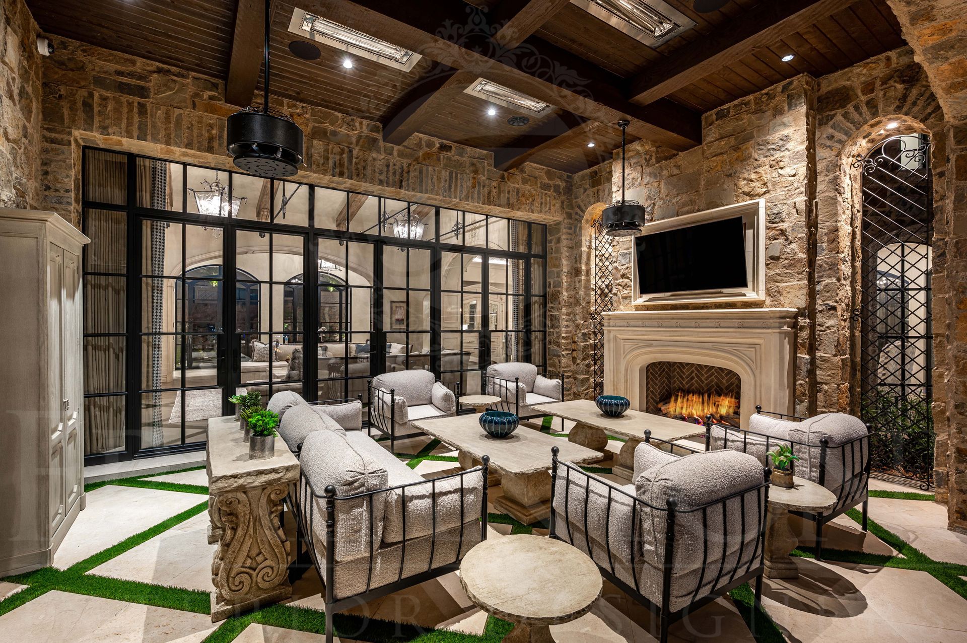 French luxury patio design with custom fireplace design and open concept doors