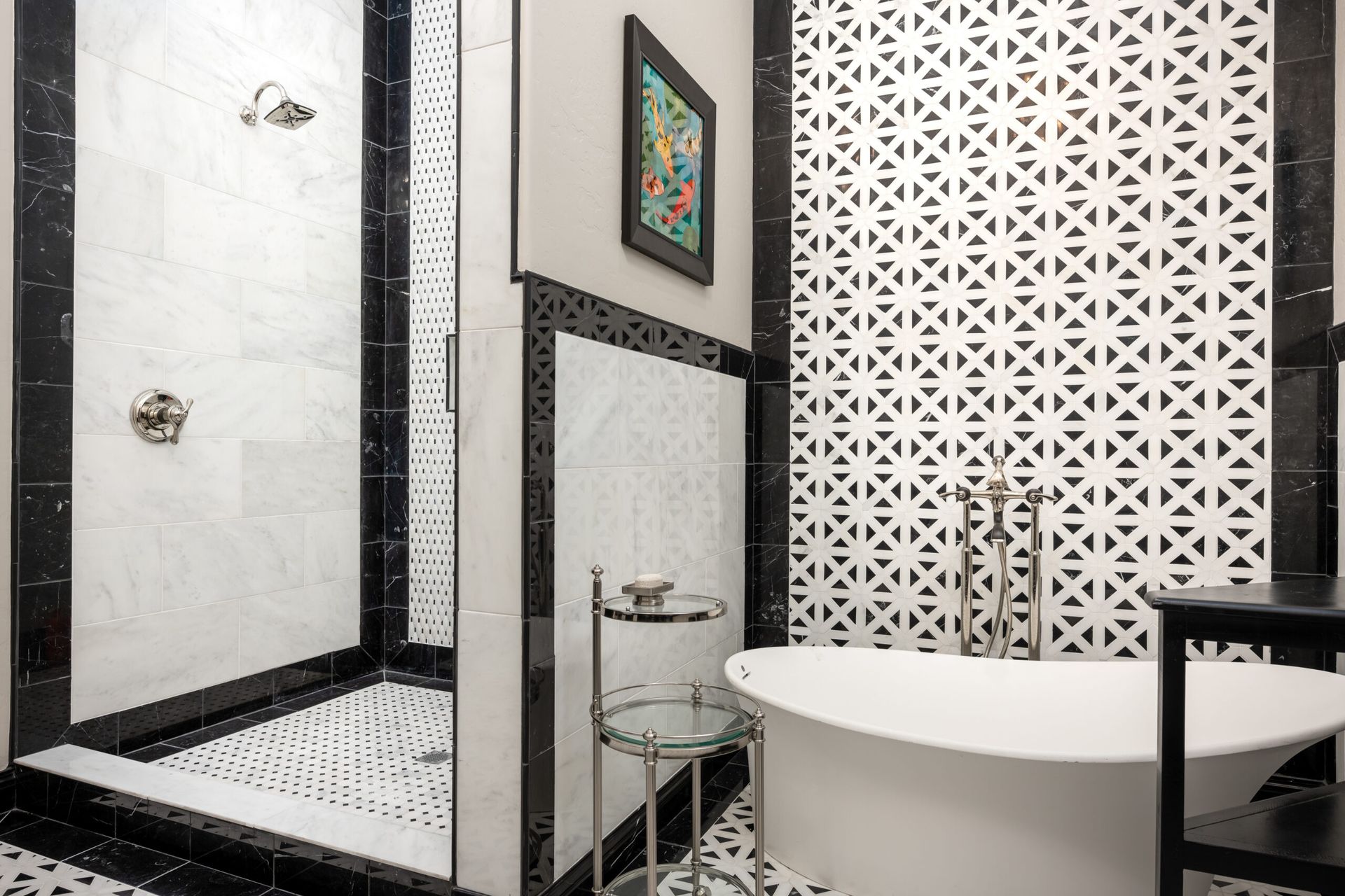 A bathroom with a tub , shower , and mirror.