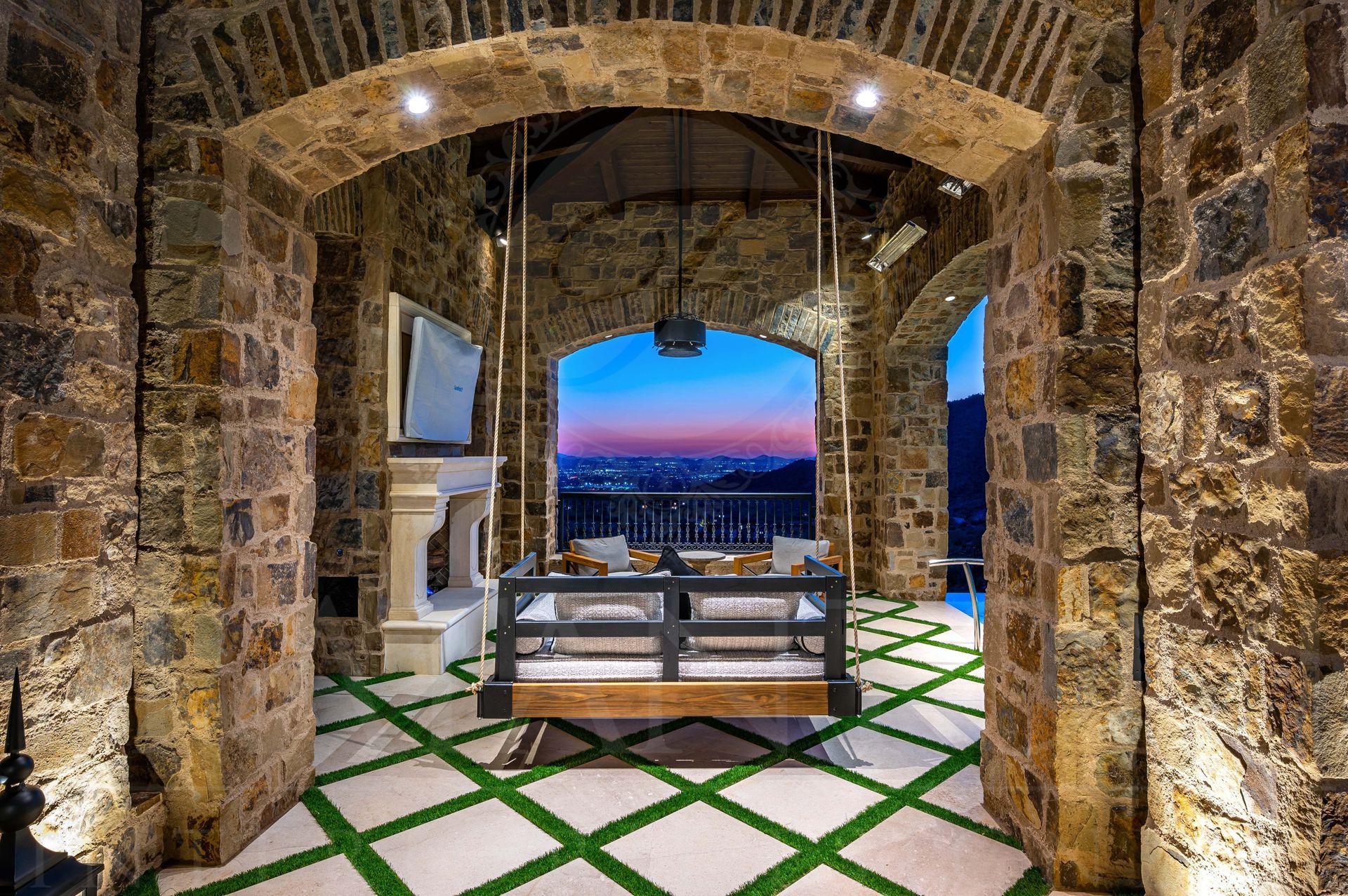 French luxury patio interior design with swing and stone arches