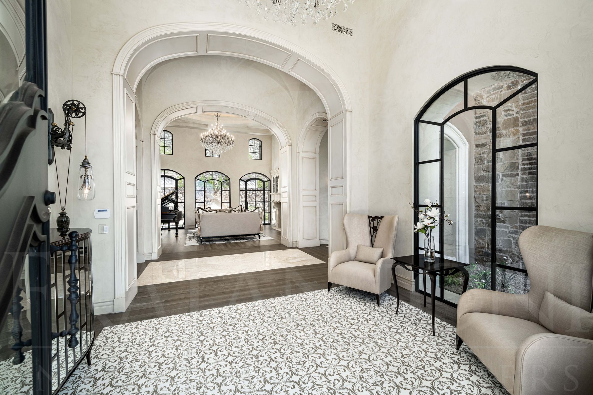 French style hallway interior design with arches, custom mosaic floors